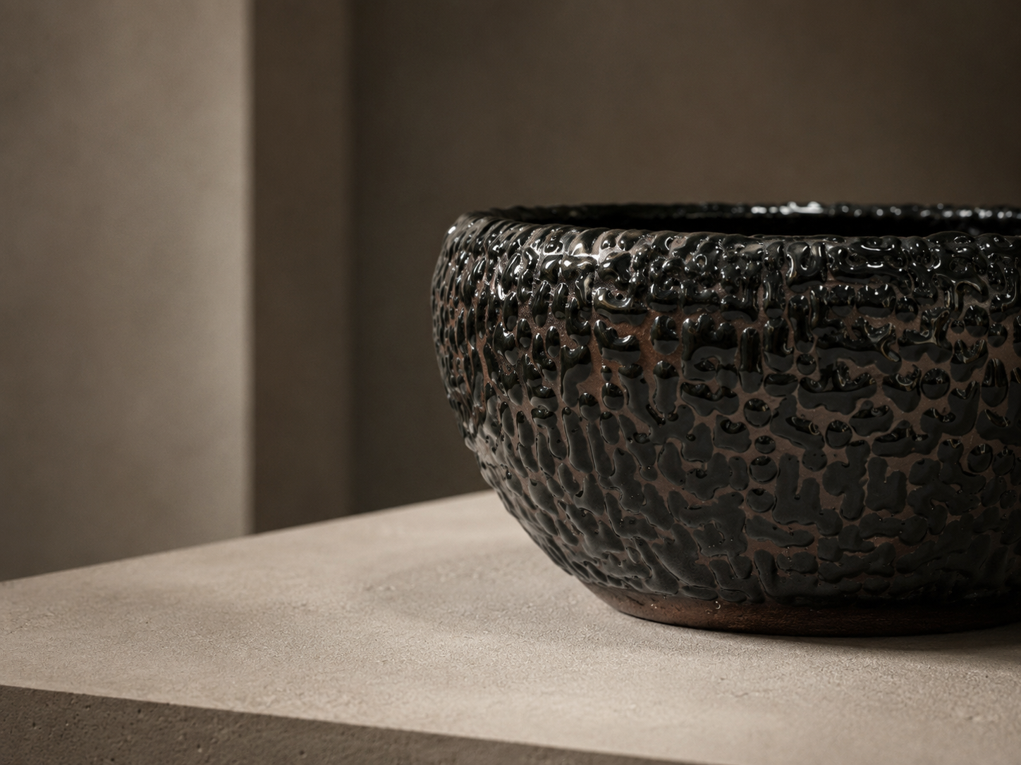 Close study of a dark textured ceramic surface