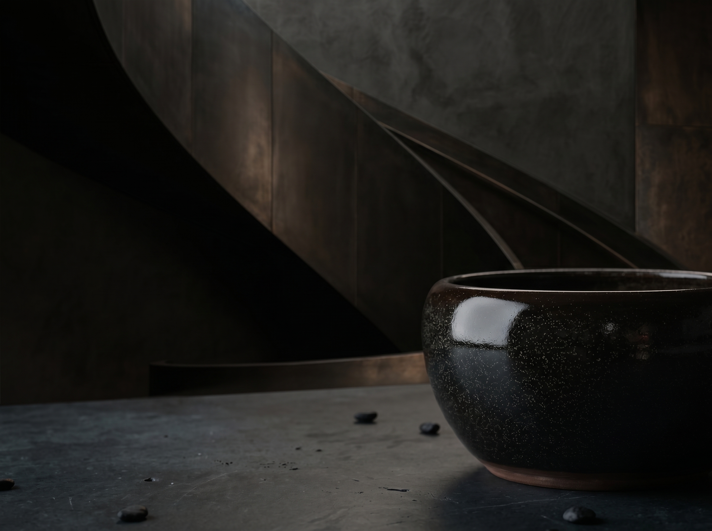 Dark atmospheric study with a ceramic object and sculptural shadows